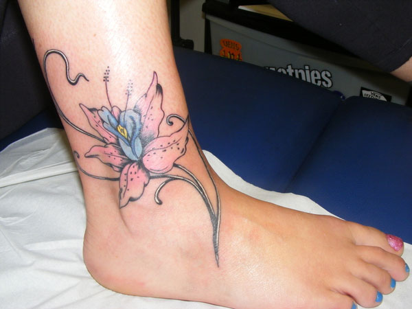 Here's What A Lily Tattoo Really Means