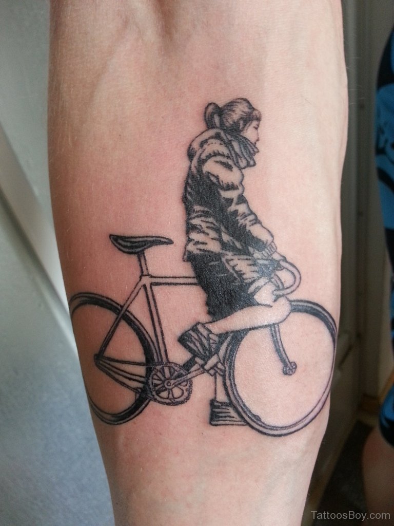 Continuous line bicycle tattoo on the left inner arm.
